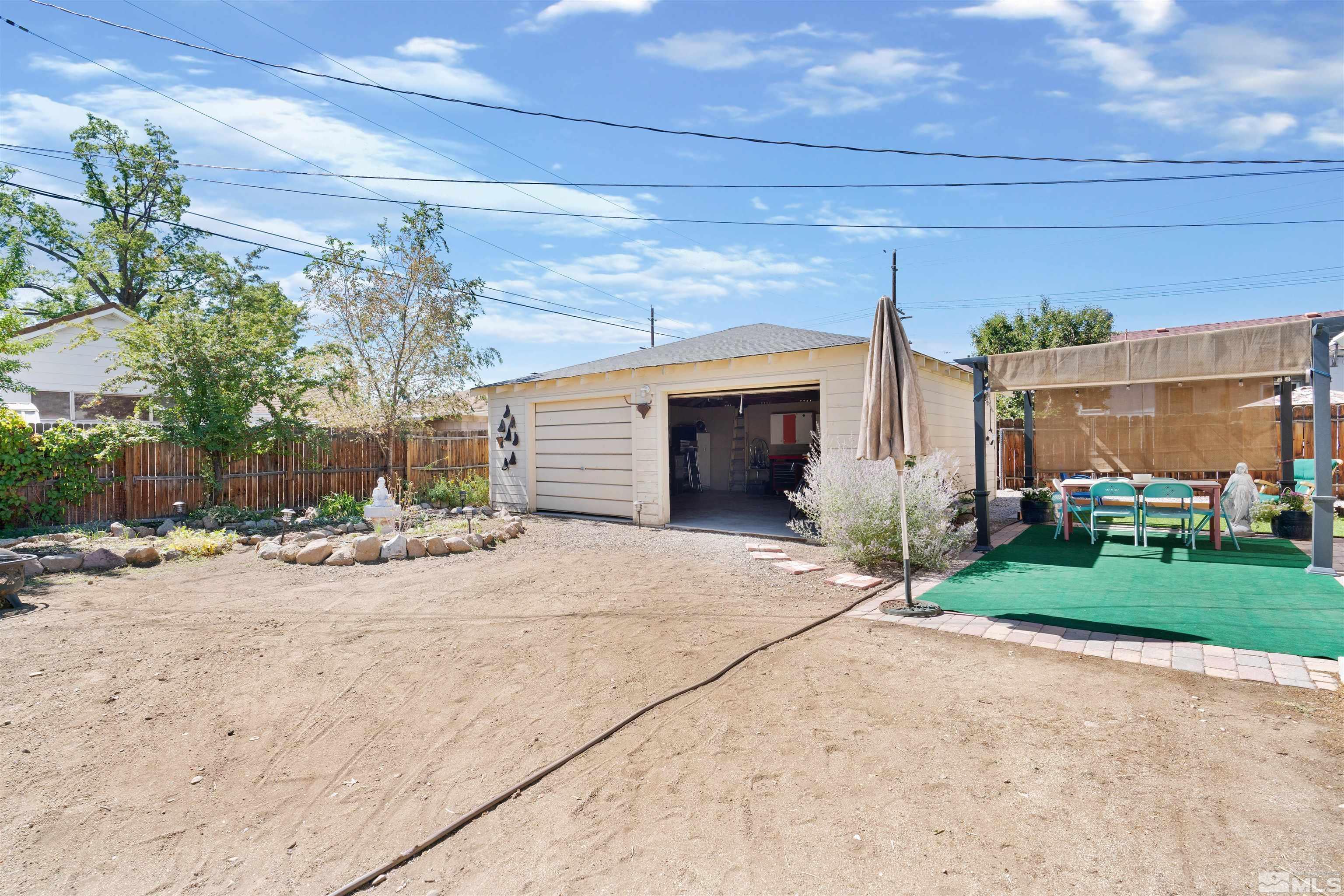 704 Balzar Circle Reno, NV 89502 - Photo 28 of 32 a view of a house with a yard and garage