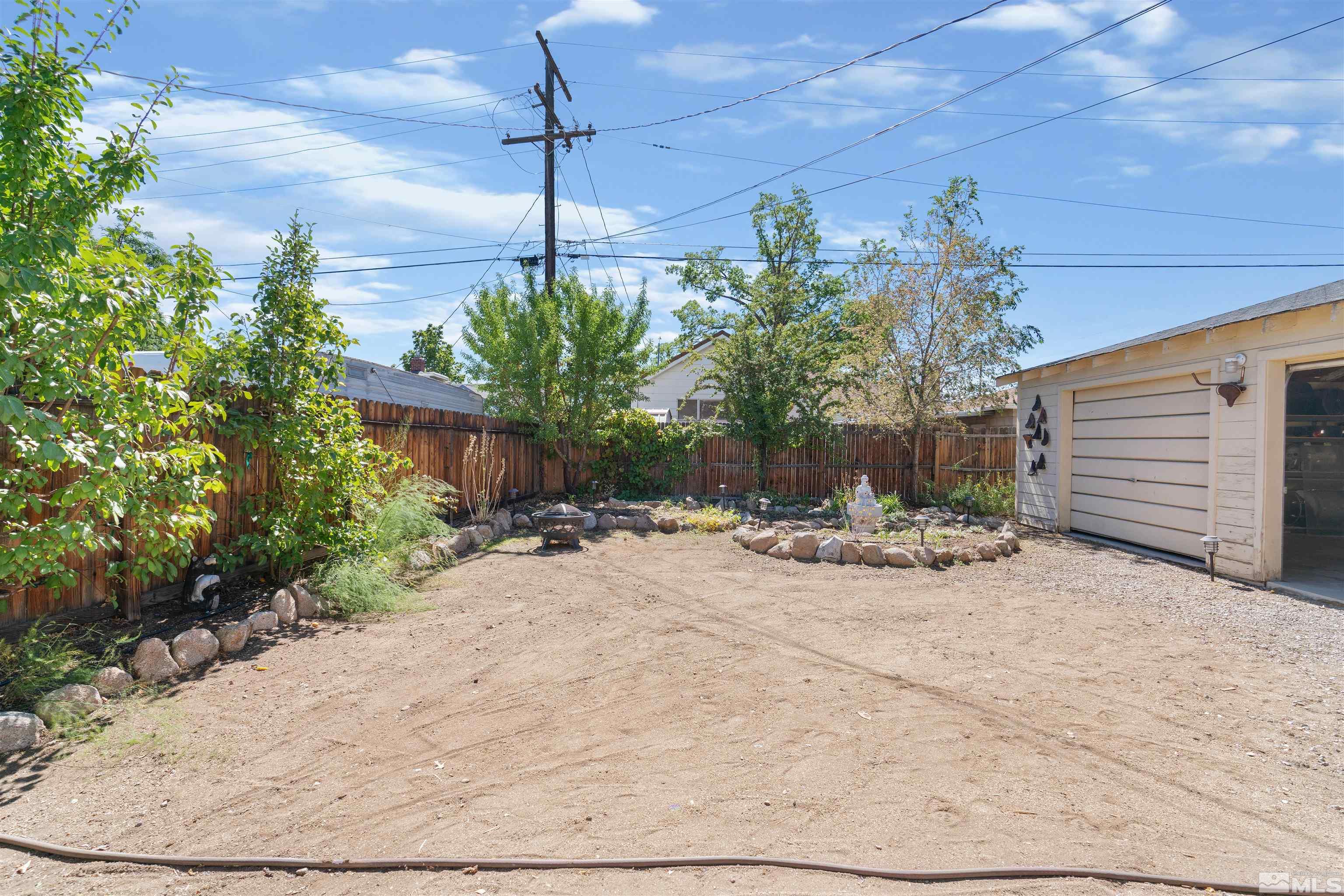 704 Balzar Circle Reno, NV 89502 - Photo 29 of 32 a view of a backyard with plants and outdoor seating