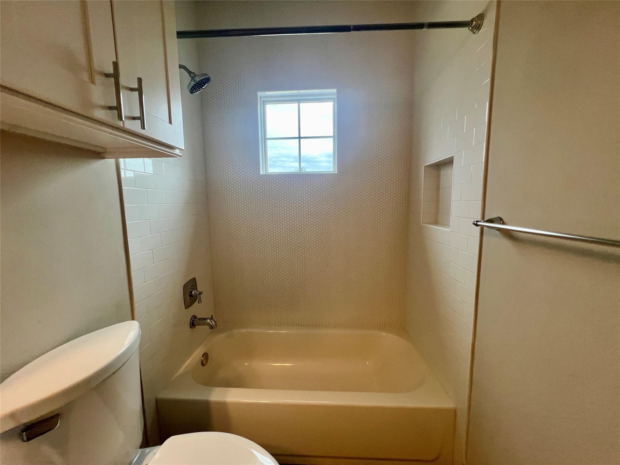 6515 Davis Lane, Unit 10 Austin, TX 78749 - Photo 20 of 22 A well-appointed bathroom offers a tiled shower with a window for natural illumination.