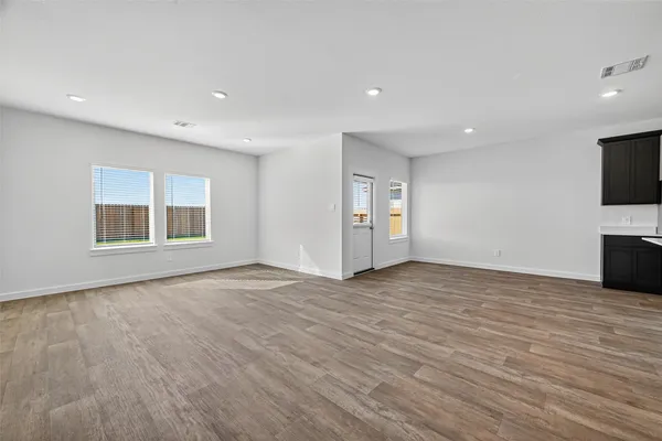 a view of kitchen with a sink and refrigerator