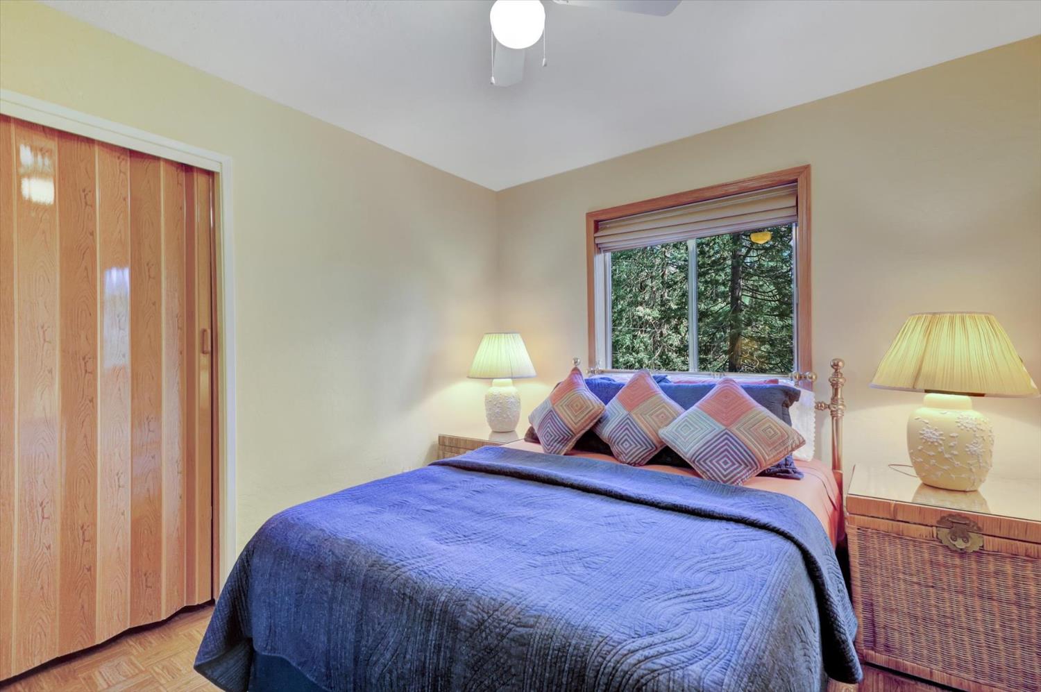 17028 Banner Quaker Hill Road Nevada City, CA 95959 - Photo 24 of 79 a bedroom with a bed and a window