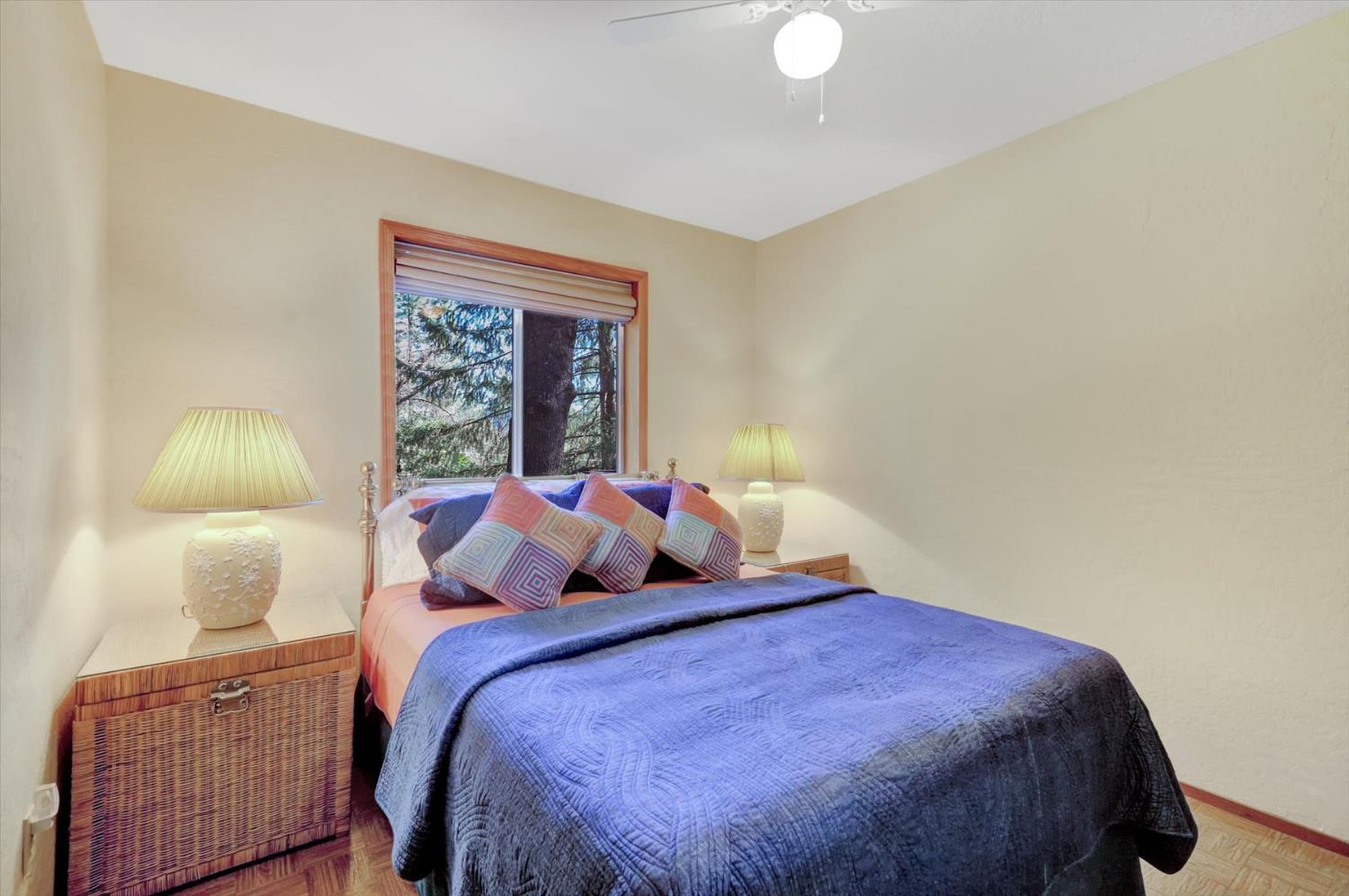 17028 Banner Quaker Hill Road Nevada City, CA 95959 - Photo 25 of 79 a bedroom with a bed and a night stand