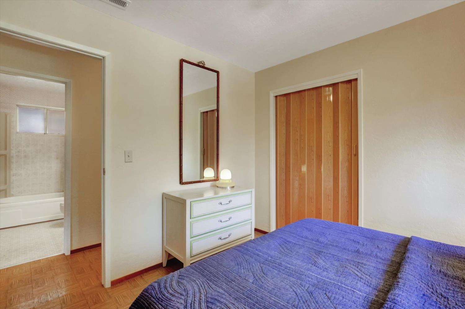 17028 Banner Quaker Hill Road Nevada City, CA 95959 - Photo 27 of 79 a bedroom with a bed and a dresser