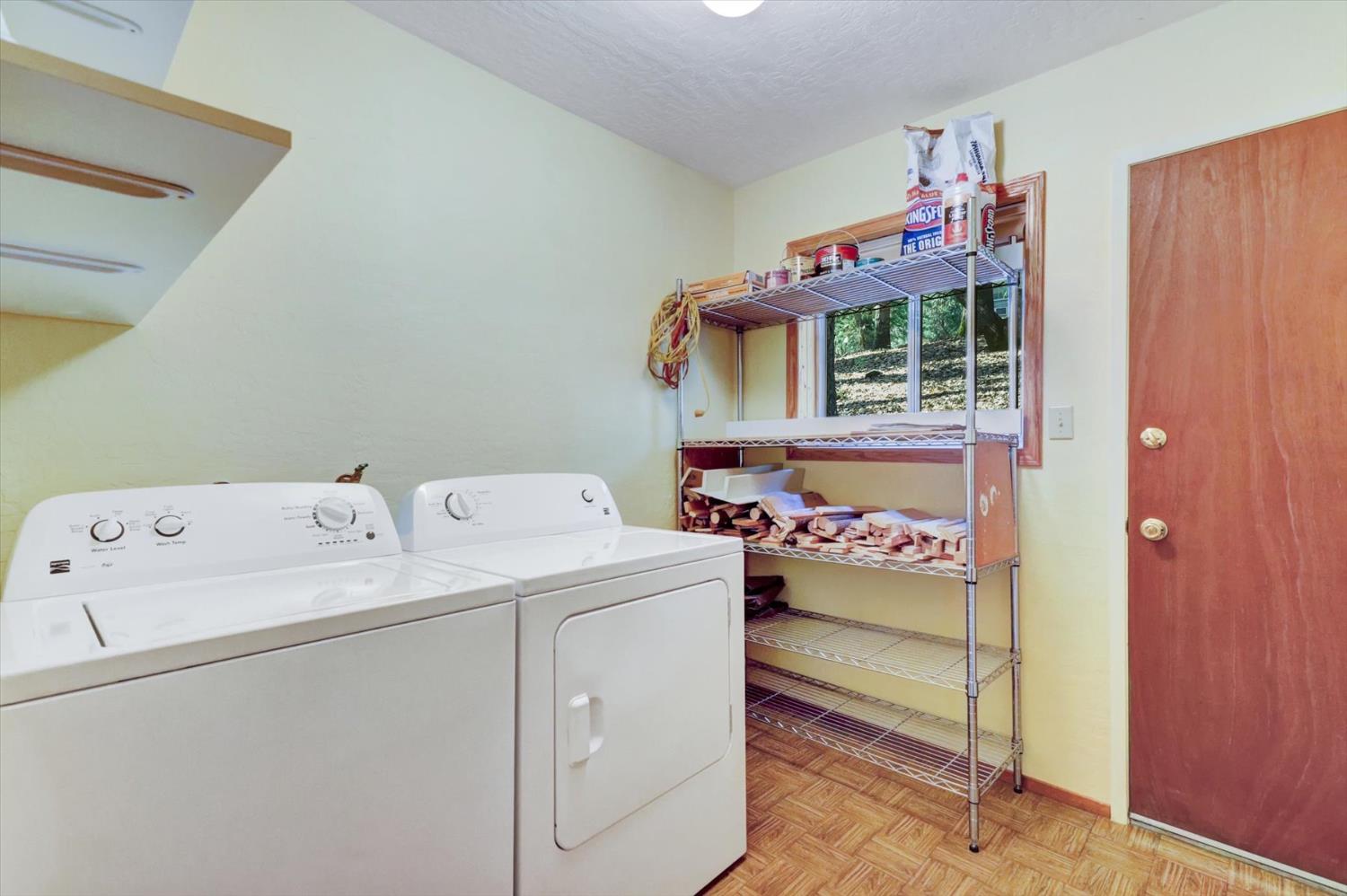 17028 Banner Quaker Hill Road Nevada City, CA 95959 - Photo 28 of 79 a utility room with dryer and washer