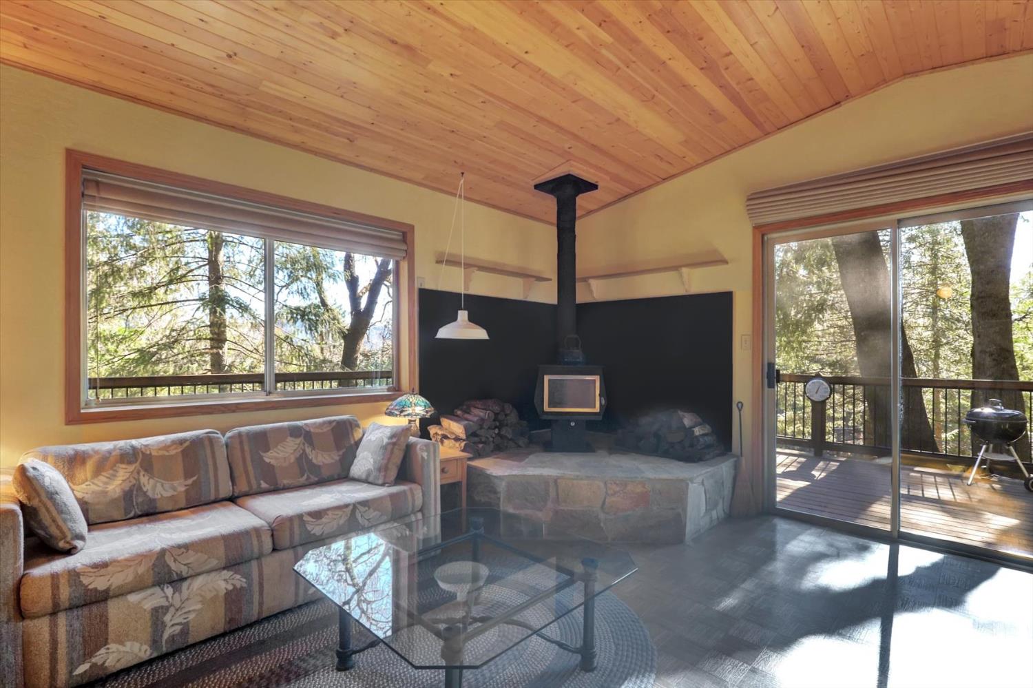 17028 Banner Quaker Hill Road Nevada City, CA 95959 - Photo 3 of 79 a living room with furniture and a fireplace