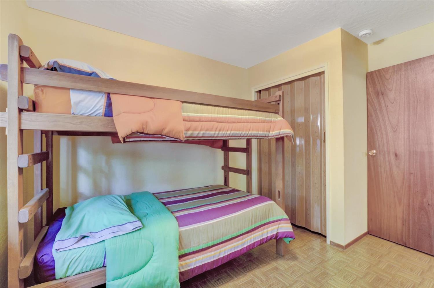 17028 Banner Quaker Hill Road Nevada City, CA 95959 - Photo 35 of 79 a bedroom with a bed and painted walls
