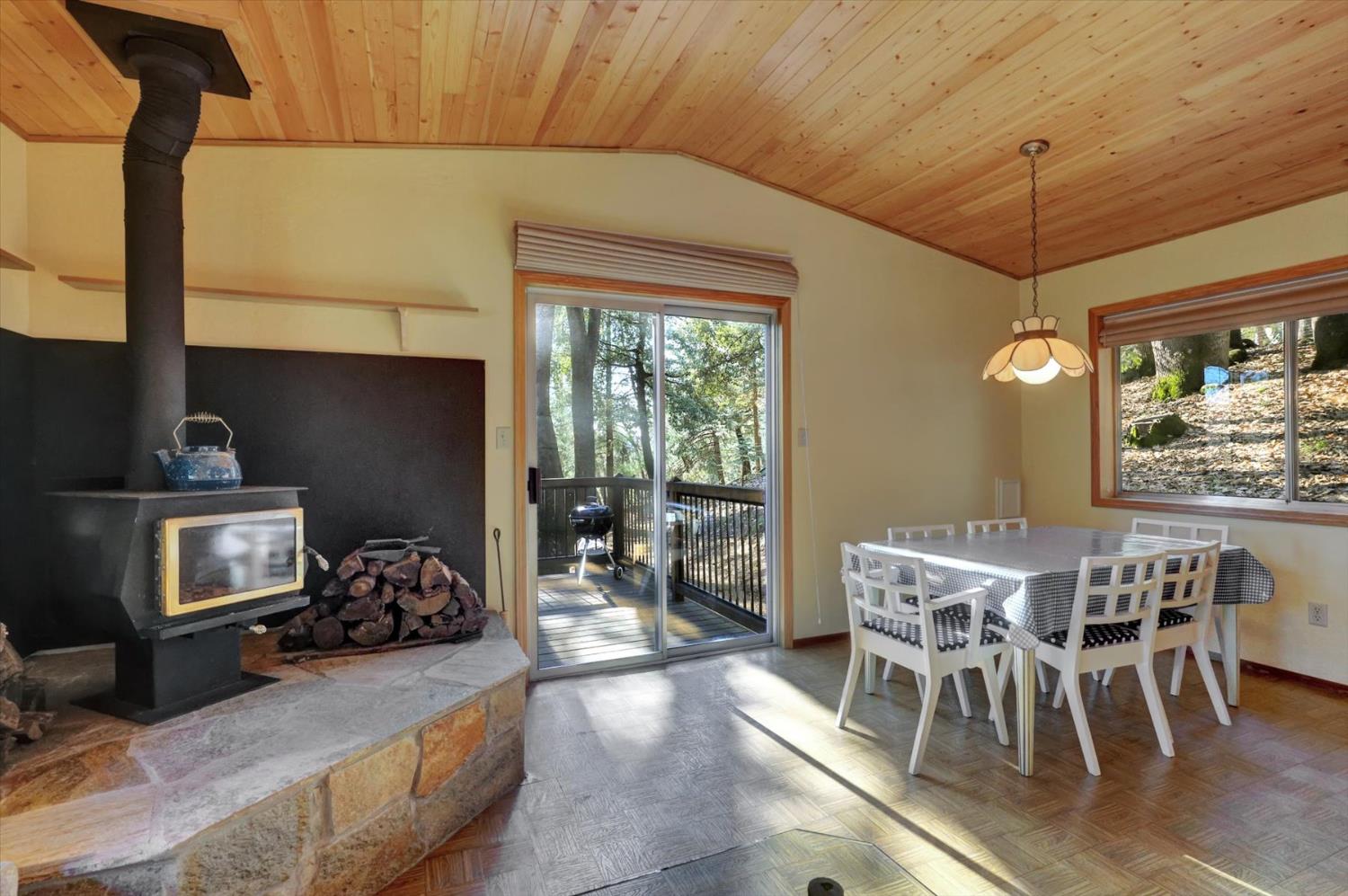 17028 Banner Quaker Hill Road Nevada City, CA 95959 - Photo 5 of 79 a view of a dining room with furniture window and outside view