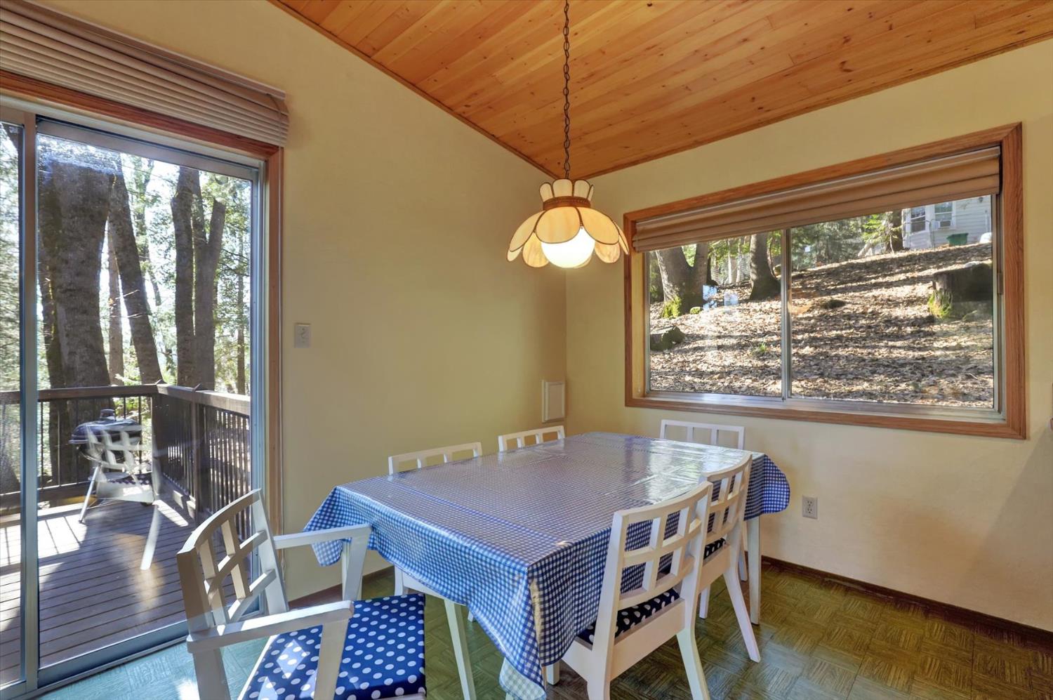17028 Banner Quaker Hill Road Nevada City, CA 95959 - Photo 9 of 79 a view of a dining room with furniture window and wooden floor