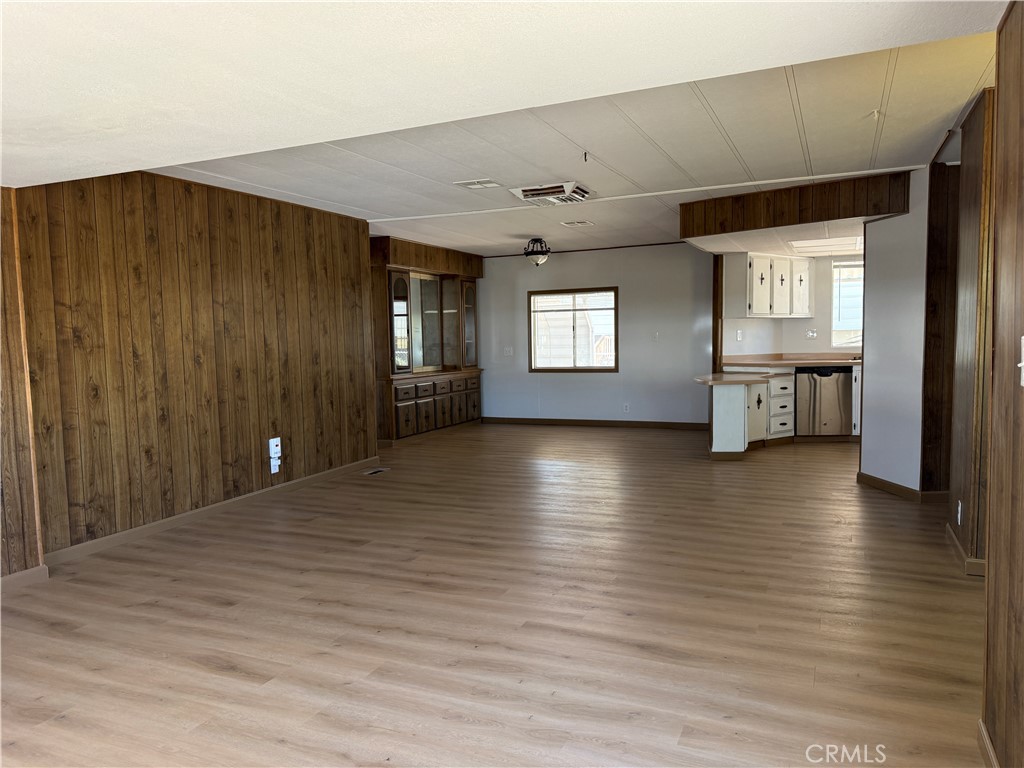 148600 Panoply Road Needles, CA 92363 - Photo 21 of 32 a view of an empty room with window and wooden floor
