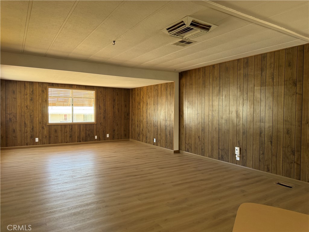 148600 Panoply Road Needles, CA 92363 - Photo 26 of 32 a view of an empty room with window and wooden floor