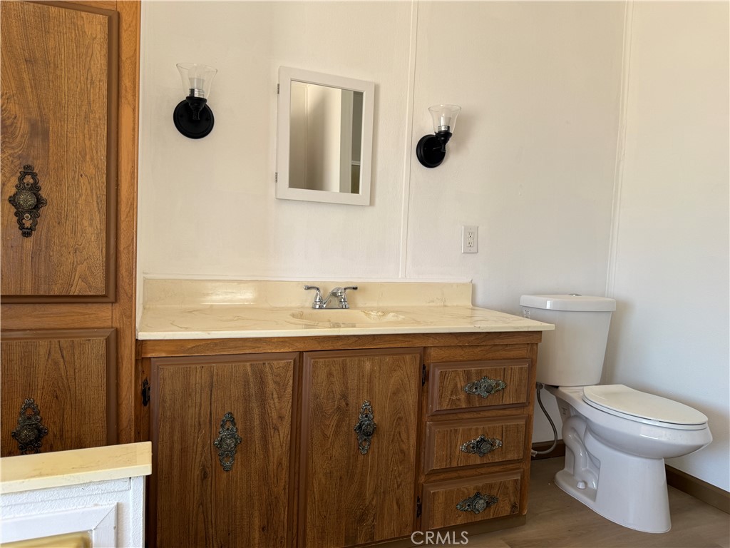 148600 Panoply Road Needles, CA 92363 - Photo 29 of 32 a bathroom with a sink a toilet and shower