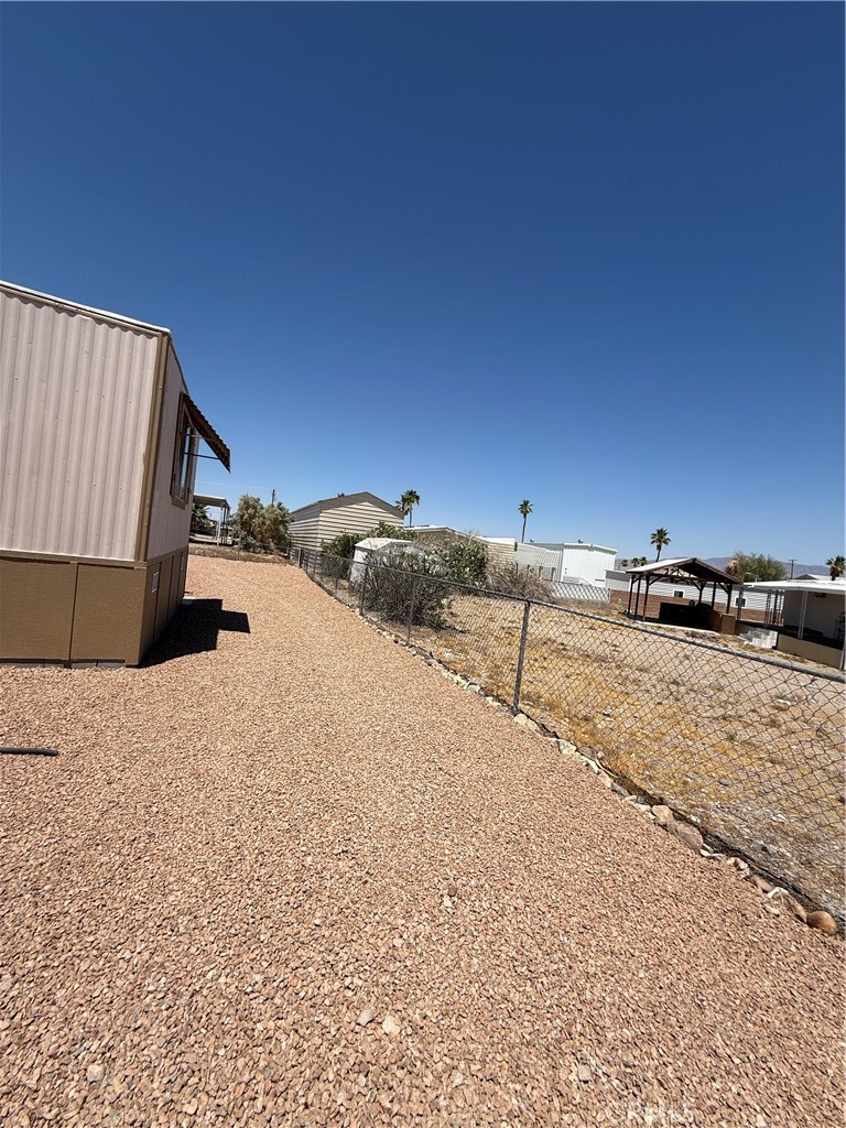 148600 Panoply Road Needles, CA 92363 - Photo 9 of 32 a view of a road with a building in the background