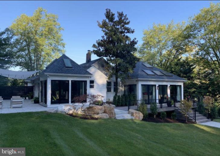 a front view of a house with a yard and porch