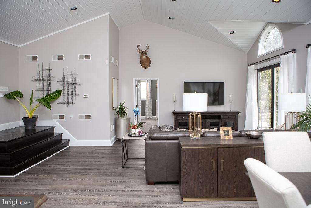 15841 York Road Sparks, MD 21152 - Photo 12 of 22 a living room with furniture a large window and a potted plant