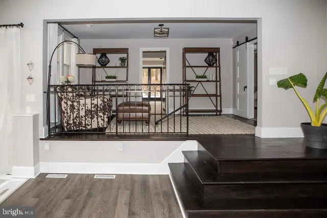 a view of a living room and entryway