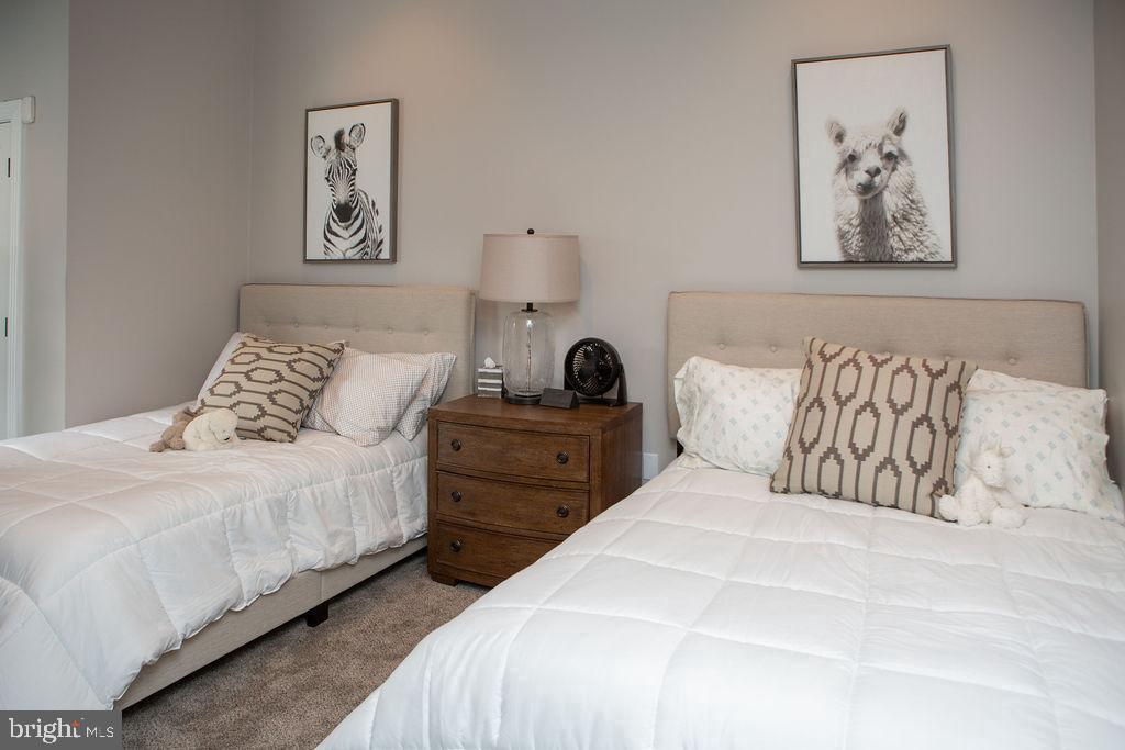 15841 York Road Sparks, MD 21152 - Photo 19 of 22 a bedroom with bed and painting on the wall