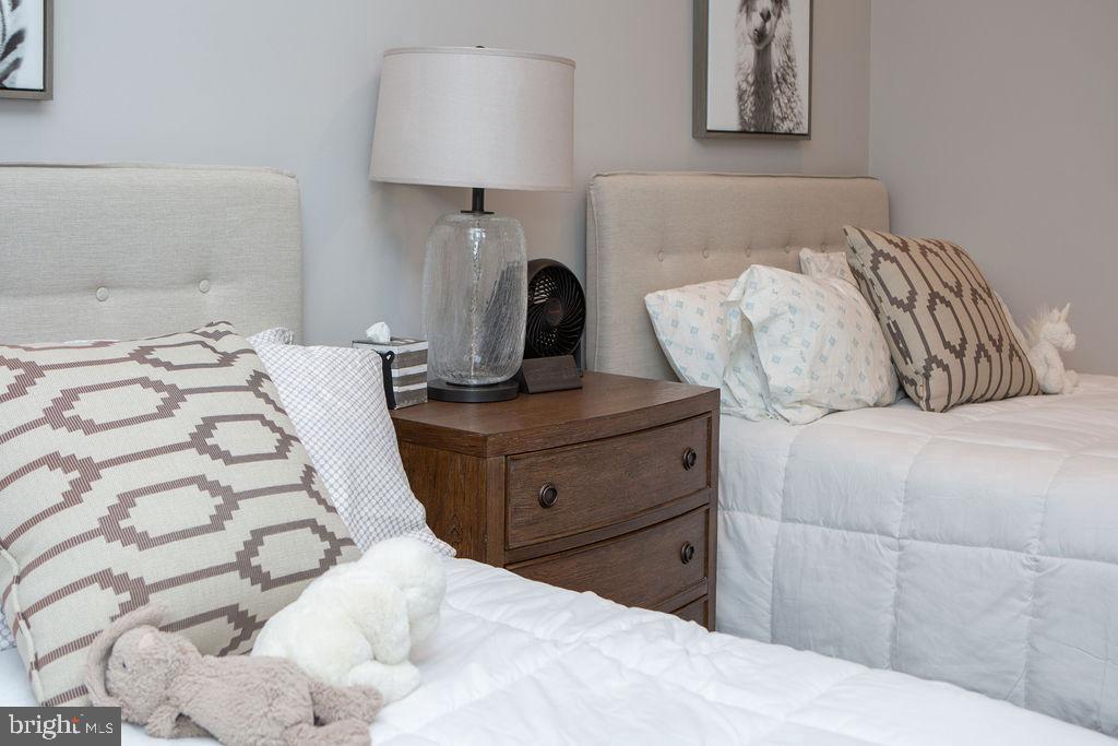 15841 York Road Sparks, MD 21152 - Photo 20 of 22 a bedroom with a bed and a lamp on dresser