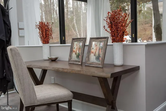a view of a dining room with furniture and window
