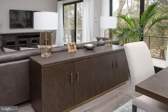 a kitchen with a sink and a potted plant