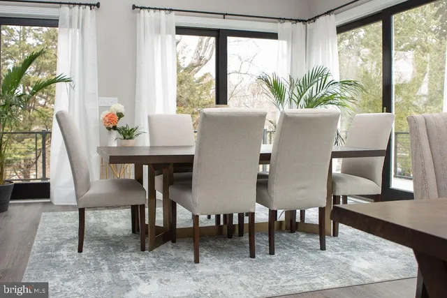 a view of a dining room with furniture window and outside view