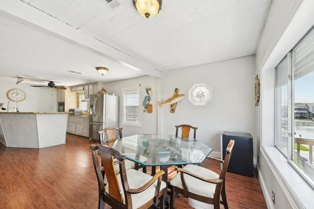 a view of a dining room with furniture and a table
