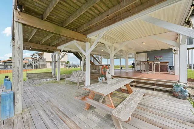 a view of a backyard with sitting area