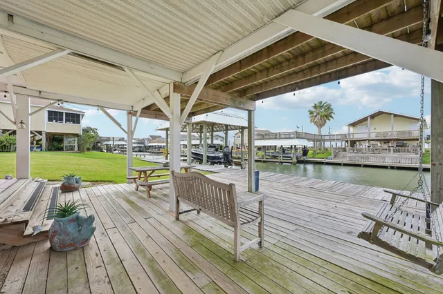 a view of a balcony with wooden floor