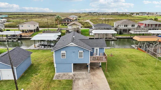 a aerial view of a house with a ocean view