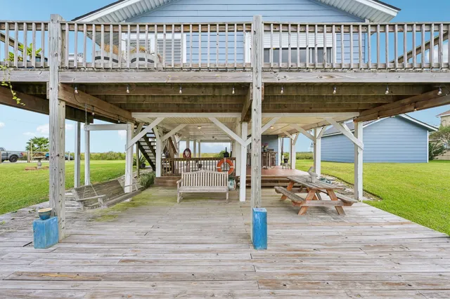 a view of a swimming pool with outdoor seating