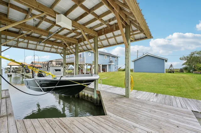 a view of a wooden deck and a yard