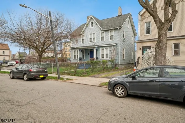 a view of a cars parked in front of a house