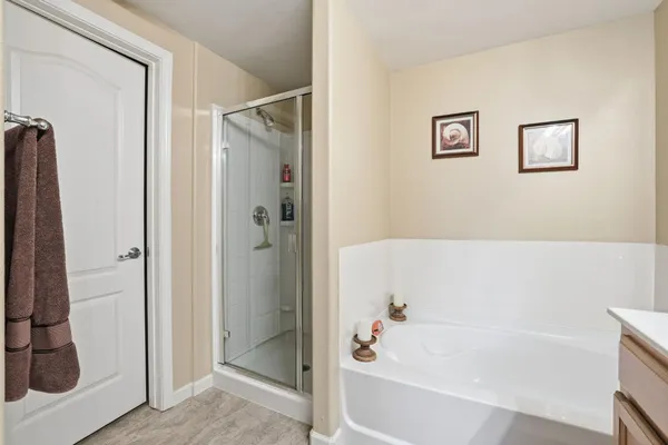 a bathroom with a bathtub and a shower