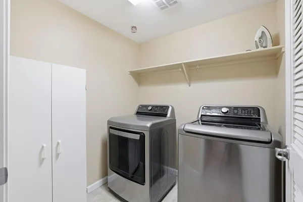 a utility room with dryer and washer
