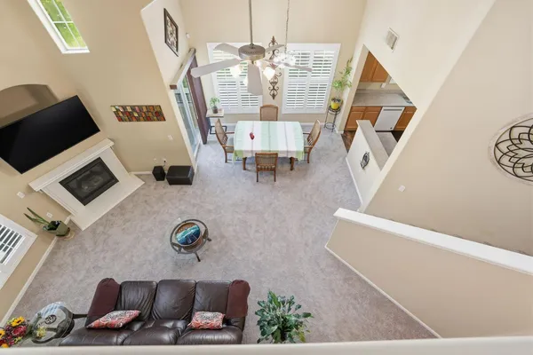 wooden floor with table and chairs