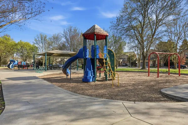 a childrens park with lots of trees