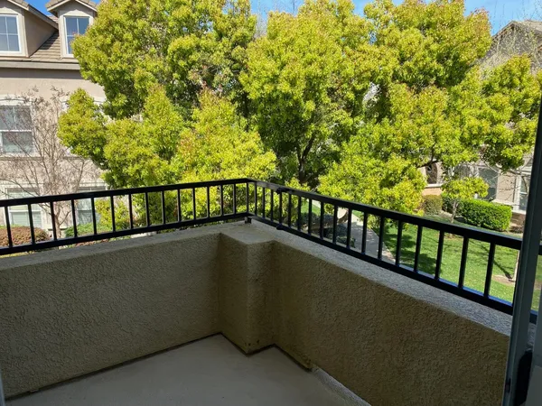 a view of balcony with a yard