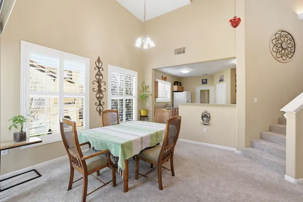 a view of a dining room with furniture window and outside view