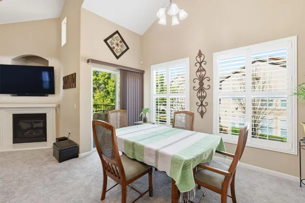 a view of a dining room with furniture window and outside view