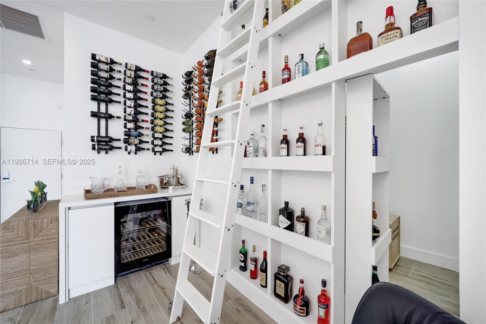 2301 Collins Avenue, Unit 1625 Miami Beach, FL 33139 - Photo 8 of 19 a kitchen with a cabinets and wooden floor