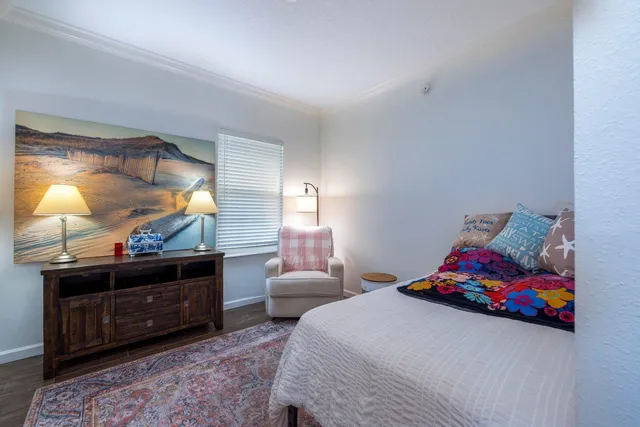 a bedroom with a bed and a dresser