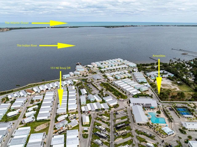 a view of swimming pool and dining table