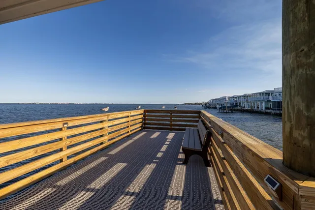 a view of outdoor space with wooden floor and city view
