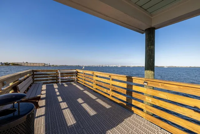 a view of balcony with wooden floor and city view