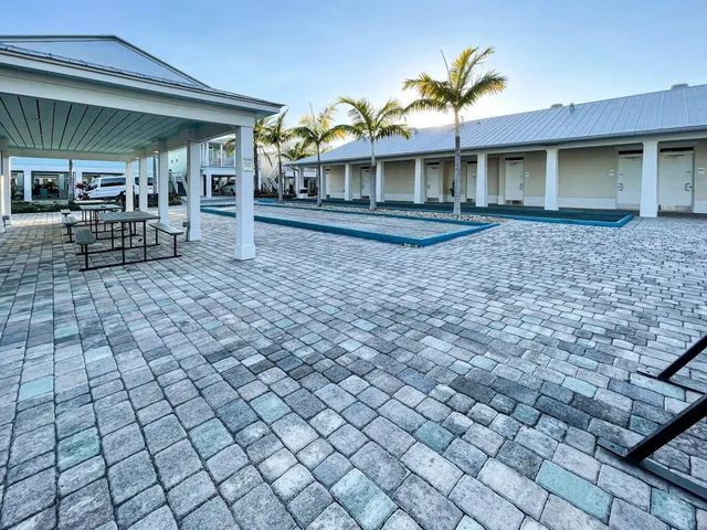 a front view of a house with a yard and glass windows