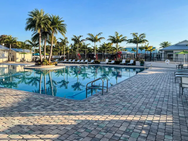 a view of a swimming pool with sitting area