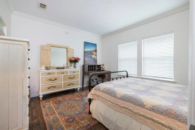 a bedroom with a bed and dresser