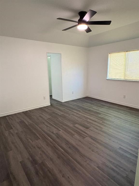 7060 Jay Lane Azle, TX 76020 - Photo 12 of 36 a view of empty room with wooden floor and fan