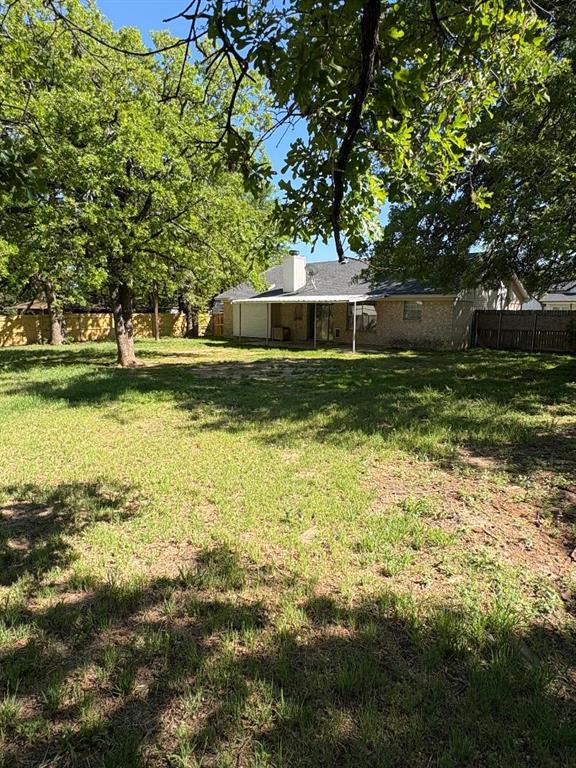7060 Jay Lane Azle, TX 76020 - Photo 17 of 36 a view of a backyard with large trees