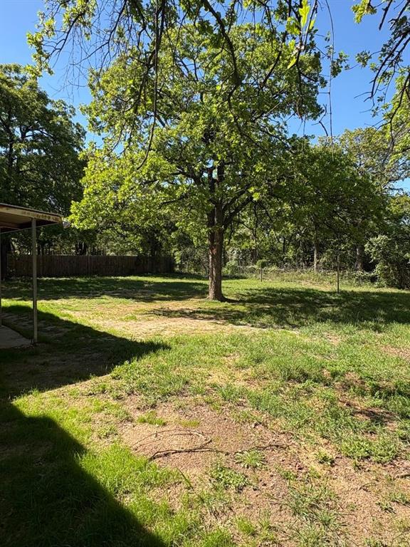 7060 Jay Lane Azle, TX 76020 - Photo 18 of 36 a view of swimming pool with a yard