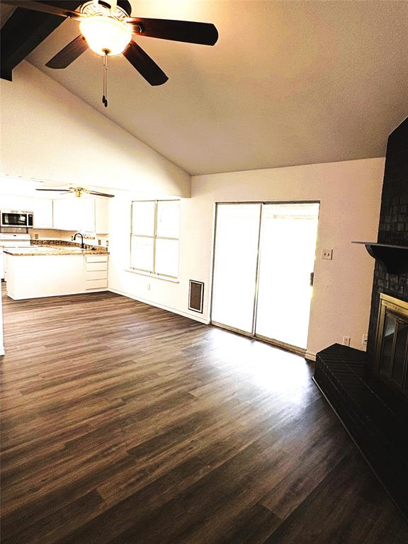 7060 Jay Lane Azle, TX 76020 - Photo 4 of 36 a view of an empty room with window and wooden floor